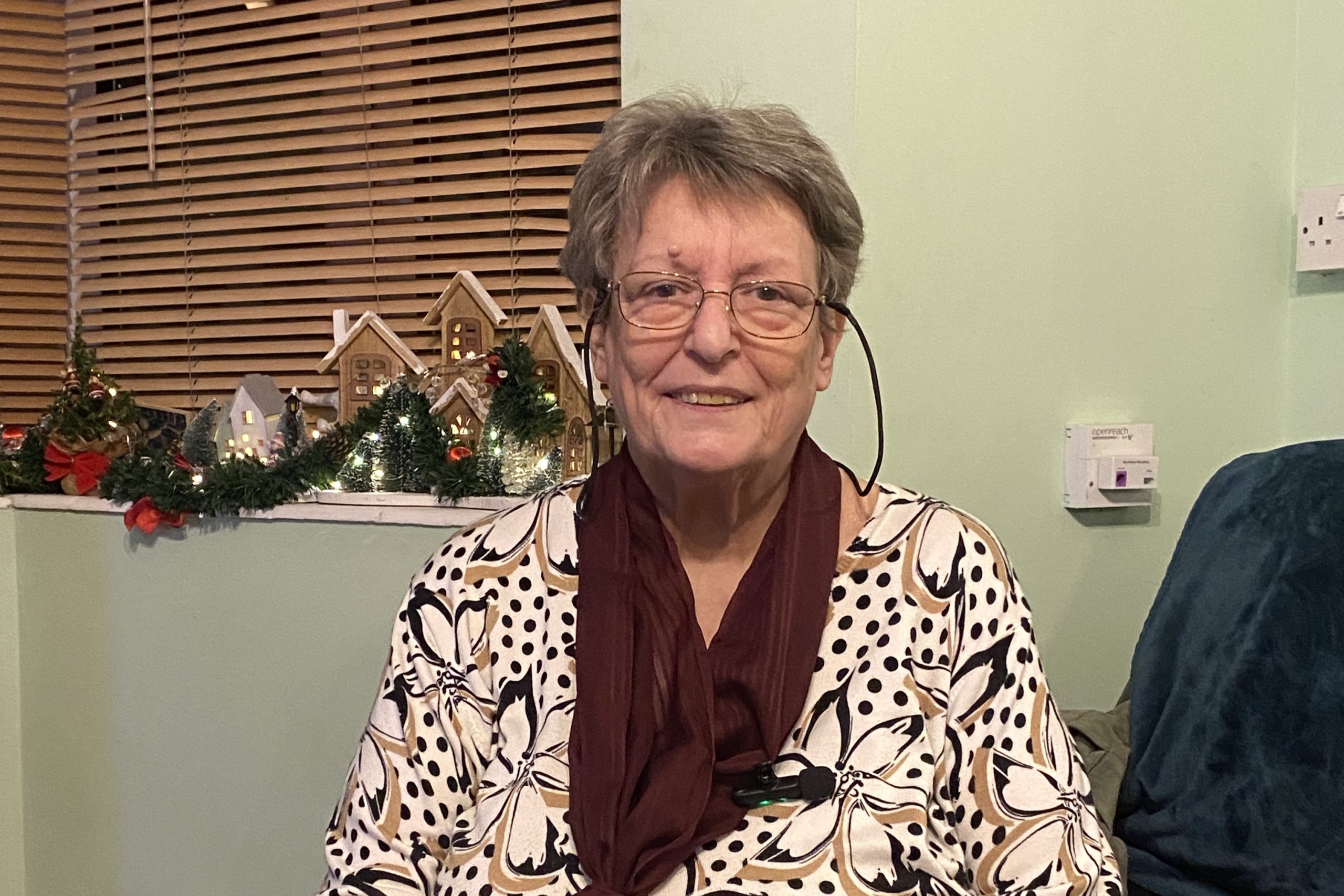 foster carer Geraldine in her living room while being interviewed