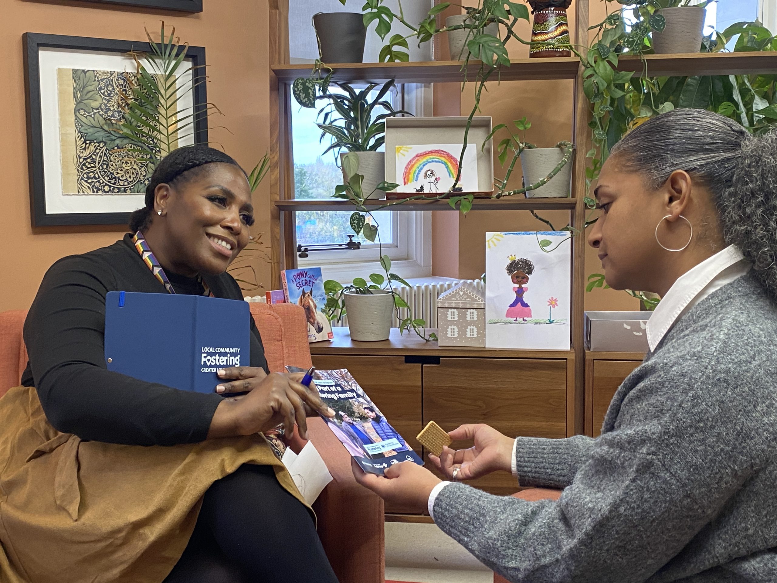 a social worker speaking to a foster carer